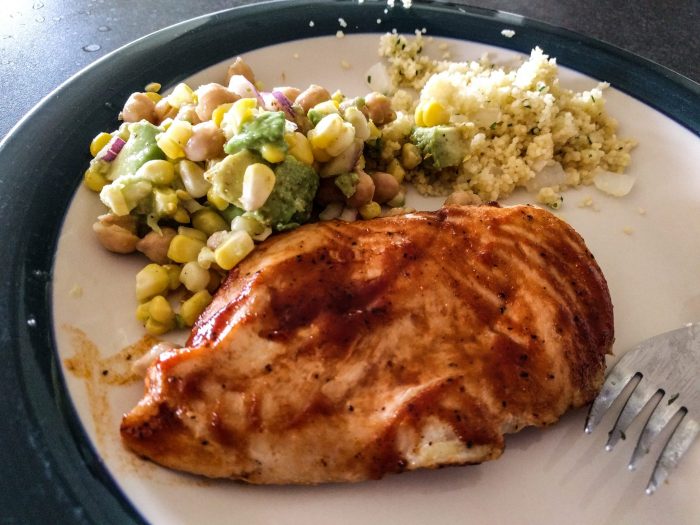 a plated salad with chicken and couscous 