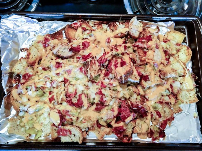 Reuben nachos ready cooked and dressed with 1000 island