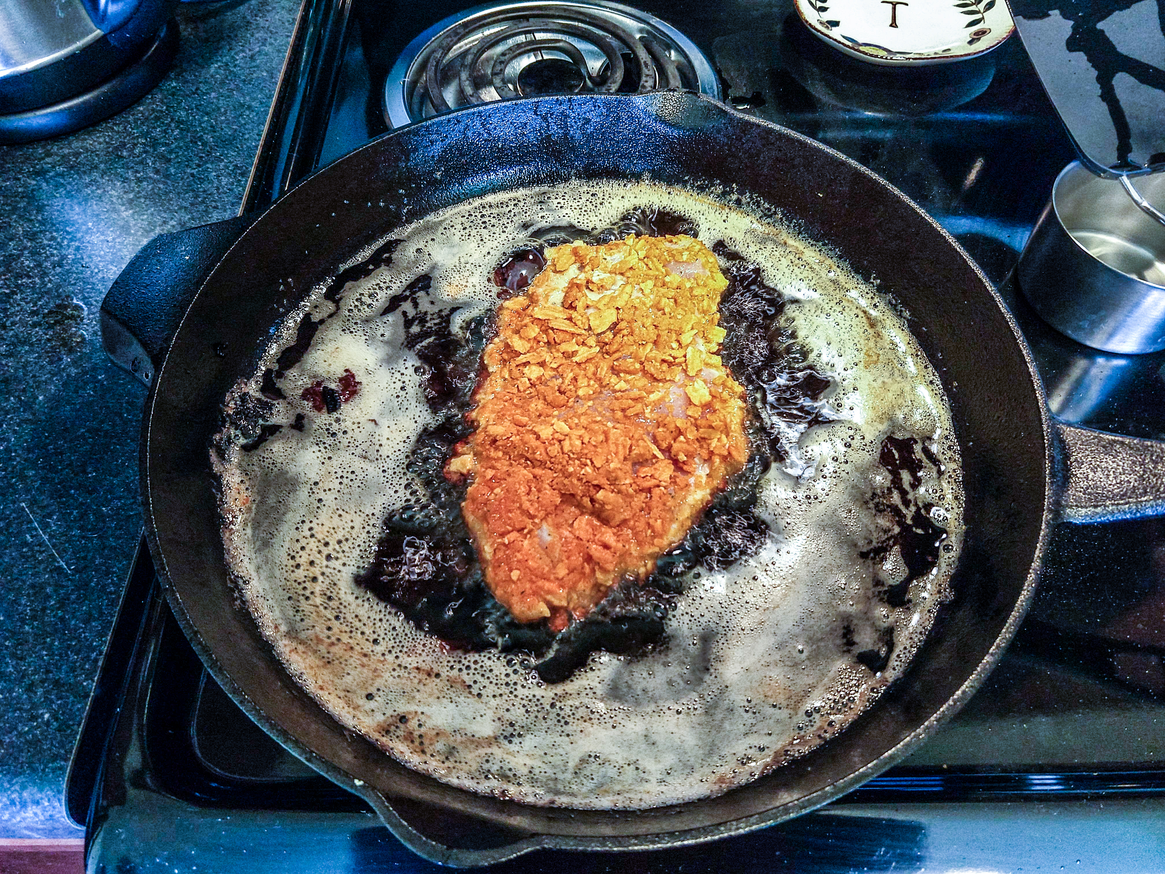 frying a spicy chicken sandwich